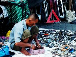 Surakarta City, Central Java, Indonesia, April 15, 2024. Notoharjo Market. The flea market is located on the outskirts of town, always busy with visitors in the morning. Buying and selling used goods photo