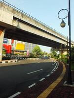 Surakarta, Central Java, Indonesia April 11, 2024. A sight seeing of Main Roads Slamet Riyadi Street in the morning. Not busy yet. People still preparing for their activity photo