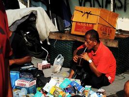 Surakarta City, Central Java, Indonesia, April 15, 2024. Notoharjo Market. The flea market is located on the outskirts of town, always busy with visitors in the morning. Buying and selling used goods photo
