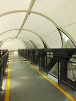 Pedestrian bridge with tunnel style design. pedestrian tunnel circle. Modern contemporary style for urban people. photo