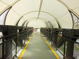 Pedestrian bridge with tunnel style design. pedestrian tunnel circle. Modern contemporary style for urban people. photo