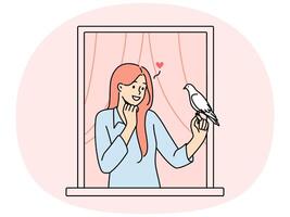 Smiling woman in window send letter with pigeon vector