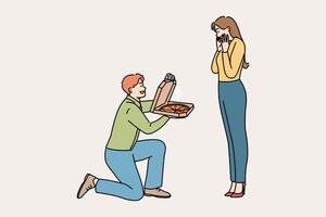 Man gives pizza to beloved, standing on knee and delighting girlfriend with food from restaurant vector
