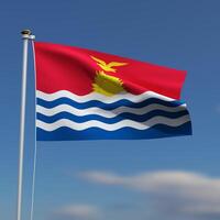 Kiribati Flag is waving in front of a blue sky with blurred clouds in the background photo