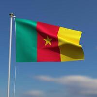 Cameroon Flag is waving in front of a blue sky with blurred clouds in the background photo