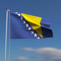 Bosnia and Herzegovina Flag is waving in front of a blue sky with blurred clouds in the background photo