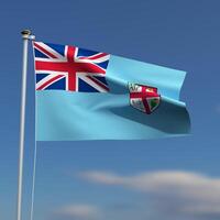 Fiji Flag is waving in front of a blue sky with blurred clouds in the background photo