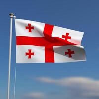 Georgia Flag is waving in front of a blue sky with blurred clouds in the background photo