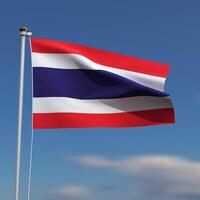 Thailand Flag is waving in front of a blue sky with blurred clouds in the background photo