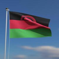 Malawi Flag is waving in front of a blue sky with blurred clouds in the background photo