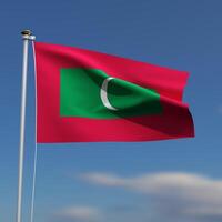 Maldives Flag is waving in front of a blue sky with blurred clouds in the background photo