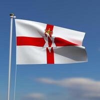 Northern Ireland Flag is waving in front of a blue sky with blurred clouds in the background photo