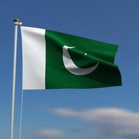 Pakistan Flag is waving in front of a blue sky with blurred clouds in the background photo