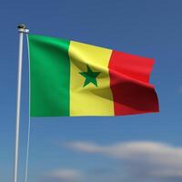 Senegal Flag is waving in front of a blue sky with blurred clouds in the background photo