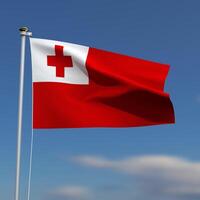 Tonga Flag is waving in front of a blue sky with blurred clouds in the background photo