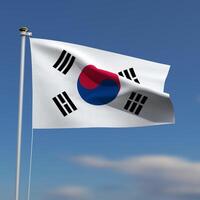 South Korea Flag is waving in front of a blue sky with blurred clouds in the background photo