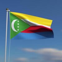 Comoros Flag is waving in front of a blue sky with blurred clouds in the background photo