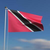 Trinidad and Tobago Flag is waving in front of a blue sky with blurred clouds in the background photo