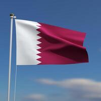 Qatar Flag is waving in front of a blue sky with blurred clouds in the background photo