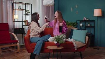 Girls friends siblings clinking glasses of wine cheering, drinking, celebrate birthday home party video