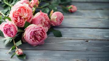 Fresh bunch of pink peonies and roses on wooden rustic background. Card Concept, pastel colors, close up image, copy space photo