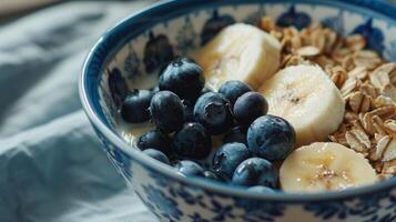 a breakfast bowl with blueberries and bananas, a breakfast bowl with blueberries and bananas. photo