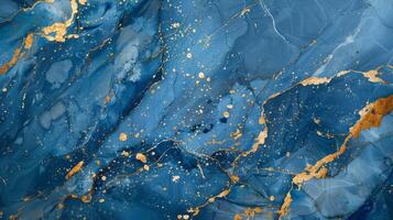 Abstract blue marble texture with gold splashes, blue luxury background. photo