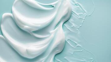 Moisturizer slashes and waves on light pastel background, hydrating face cream or lotion for skin care photo