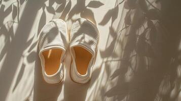 A pair of creative EVA slippers, EVA material, high-grade white background, dappled sunlight photo