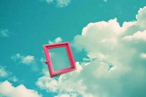 Surreal Pink Frame Floating in the Blue Sky with Clouds photo