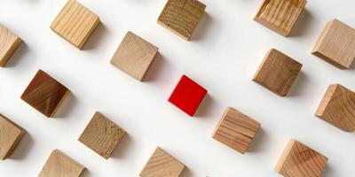 Striking Array of Natural Wood Blocks with One Red Cube photo