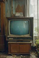 A broken television sits on a wooden stand in a room photo