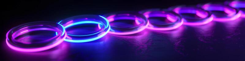 A row of neon colored rings with a blue and purple hue photo