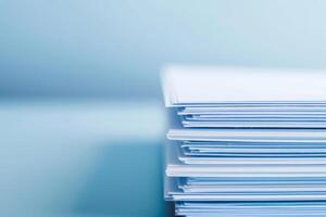A stack of blue papers with a blue background photo