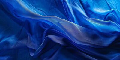 A blue fabric with a shiny texture photo