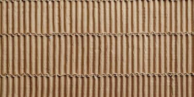 A brown cardboard strip with a pattern of lines photo