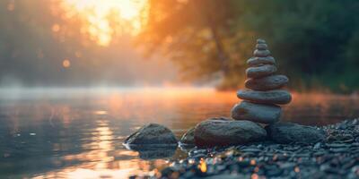 A stack of rocks is sitting on the shore of a lake photo