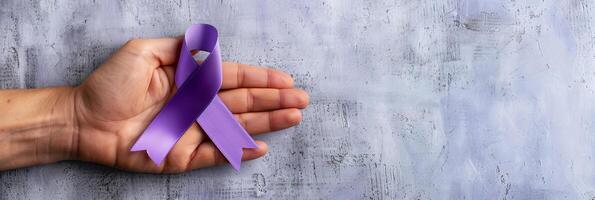 Caucasian Hand Presenting a Purple Ribbon on Textured Background photo