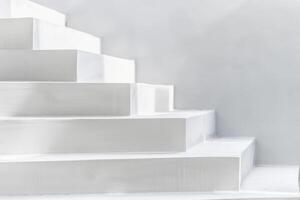 A white staircase with a white wall behind it photo