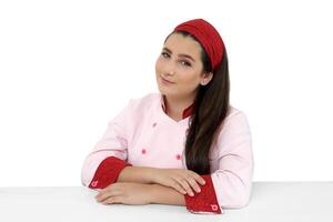 young and friendly chef posing on white background photo