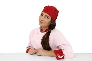 young and friendly chef posing on white background photo