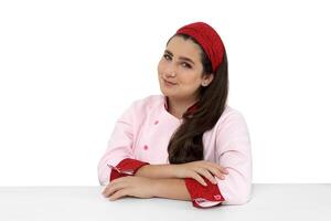 young and friendly chef posing on white background photo