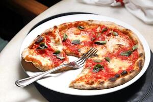 step-by-step guide on how to eat authentic Neapolitan pizza with your hands photo