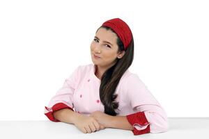 young and friendly chef posing on white background photo