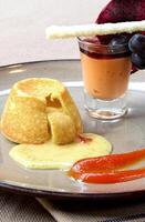 vanilla petit gateau with guava syrup and papaya cream photo
