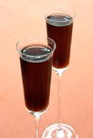 Kir Royale, sophisticated drink with cassis liqueur, champagne and red fruits photo