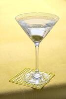 Vodka Martini, drink with vodka, dry martini and an olive in the glass photo