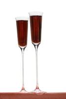 Kir Royale, sophisticated drink with cassis liqueur, champagne and red fruits photo