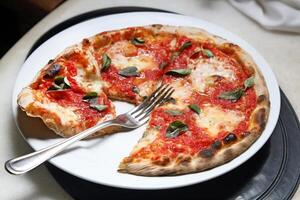 step-by-step guide on how to eat authentic Neapolitan pizza with your hands photo