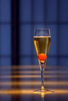 Champagne cocktail, light drink with a cube of sugar, cognac, angostura and brut champagne photo